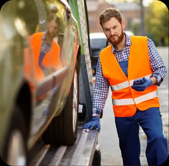 Worker inspecting a vehicle with a tablet