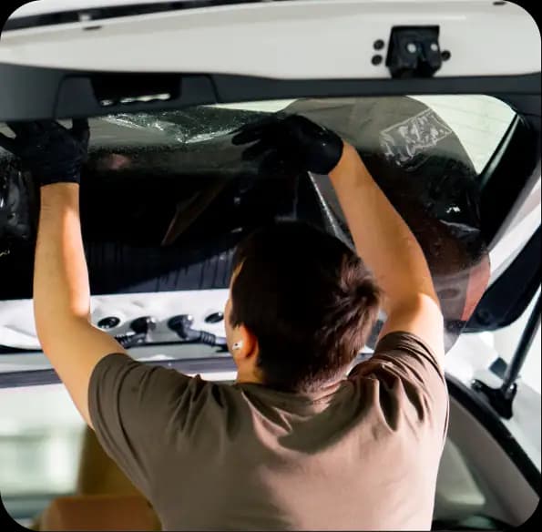 Person packing a vehicle rooftop cargo box
