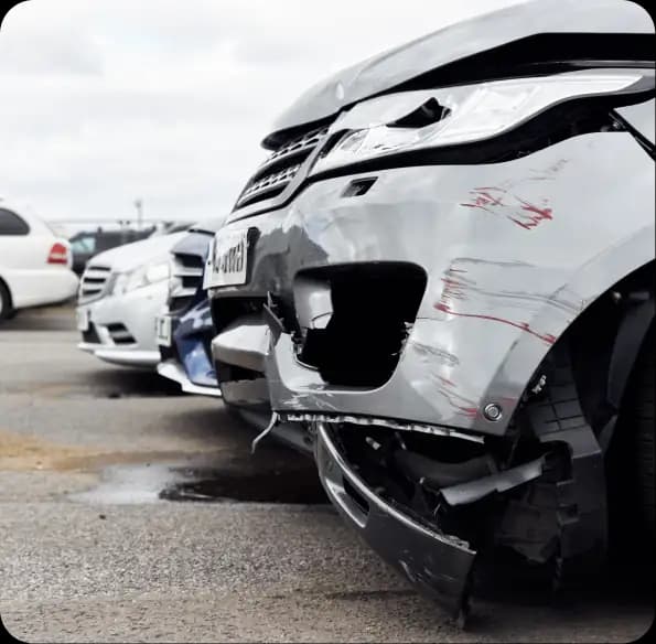 Damaged vehicles parked in a row