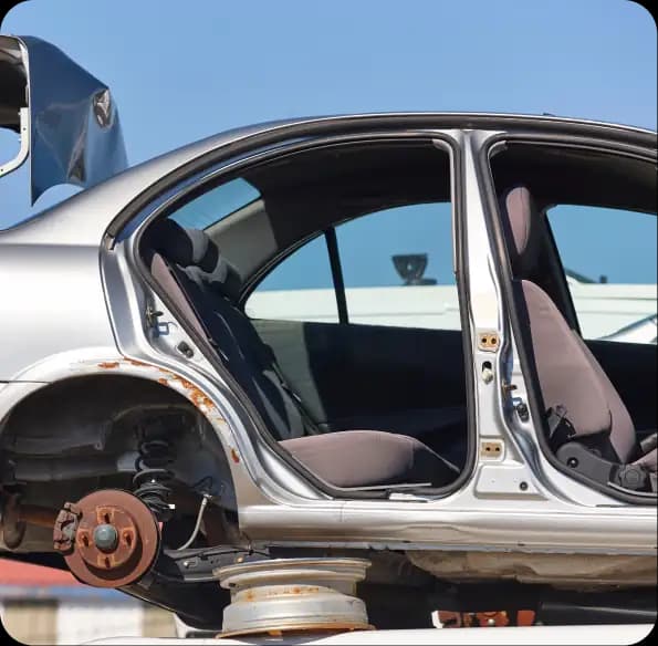 Partially dismantled car with doors and a wheel removed