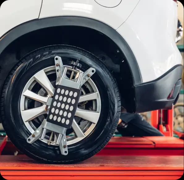 Wheel alignment equipment attached to a car wheel