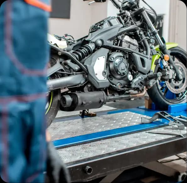 Motorcycle secured on a transport bed