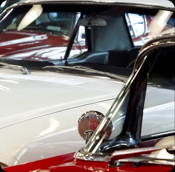 Classic cars parked in a showroom