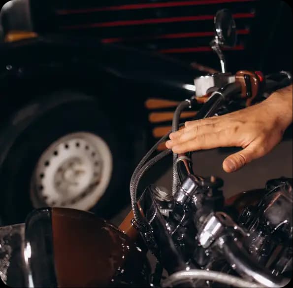 Person inspecting motorcycle controls