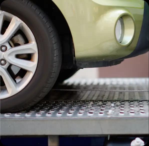 Vehicle wheel on a tow truck bed