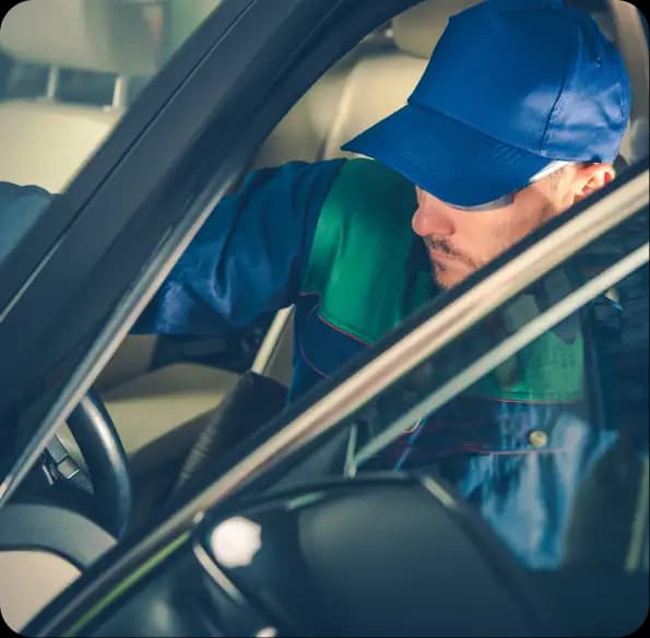 Worker looking through a car window