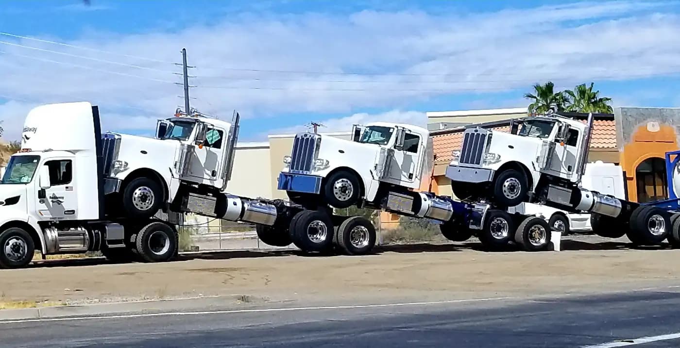 Truck cabs loaded for transport