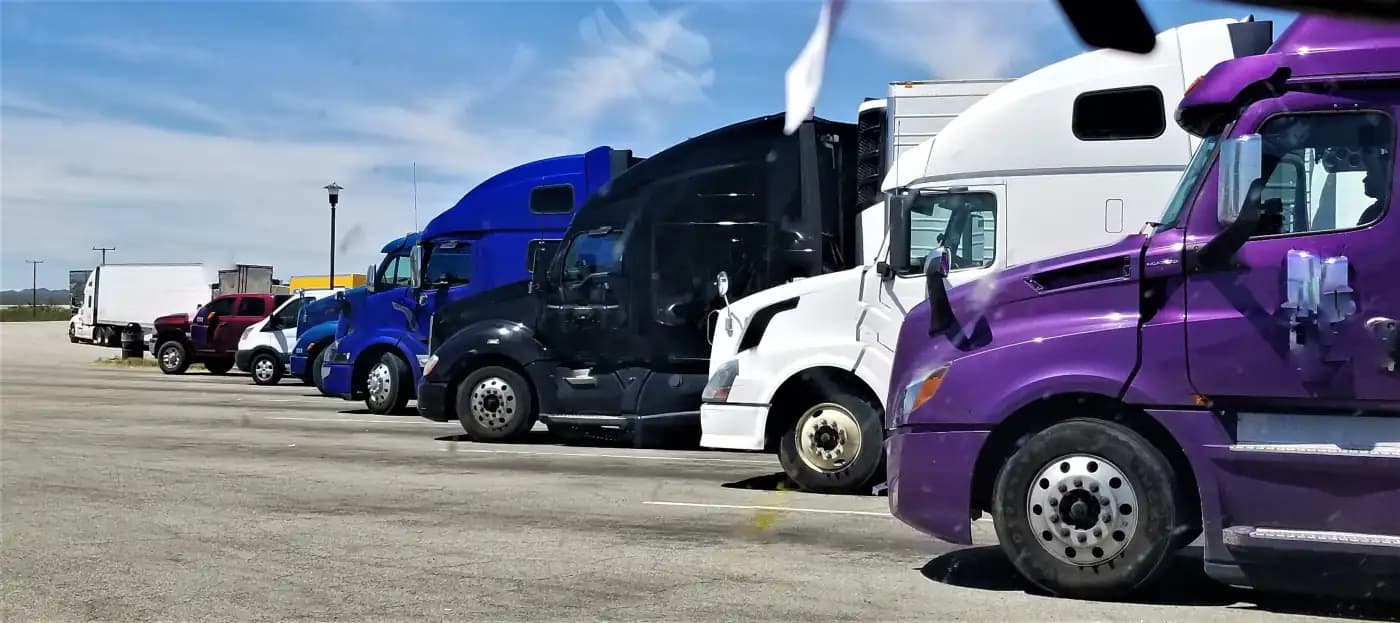 Semi-trucks parked in a row