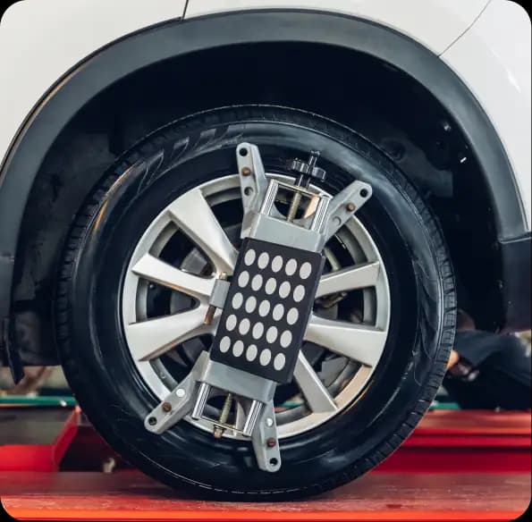 Wheel alignment equipment attached to a car wheel
