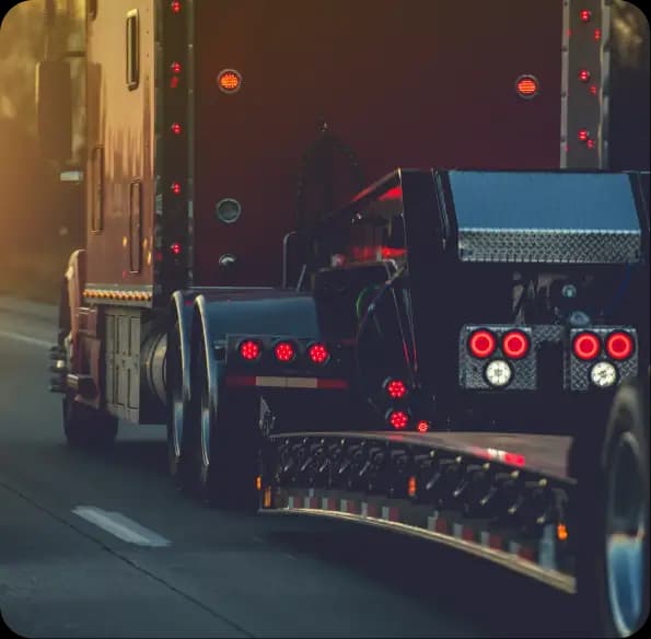Rear lights of a semi-truck on a road