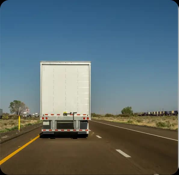 Rear of a tractor-trailer on a highway