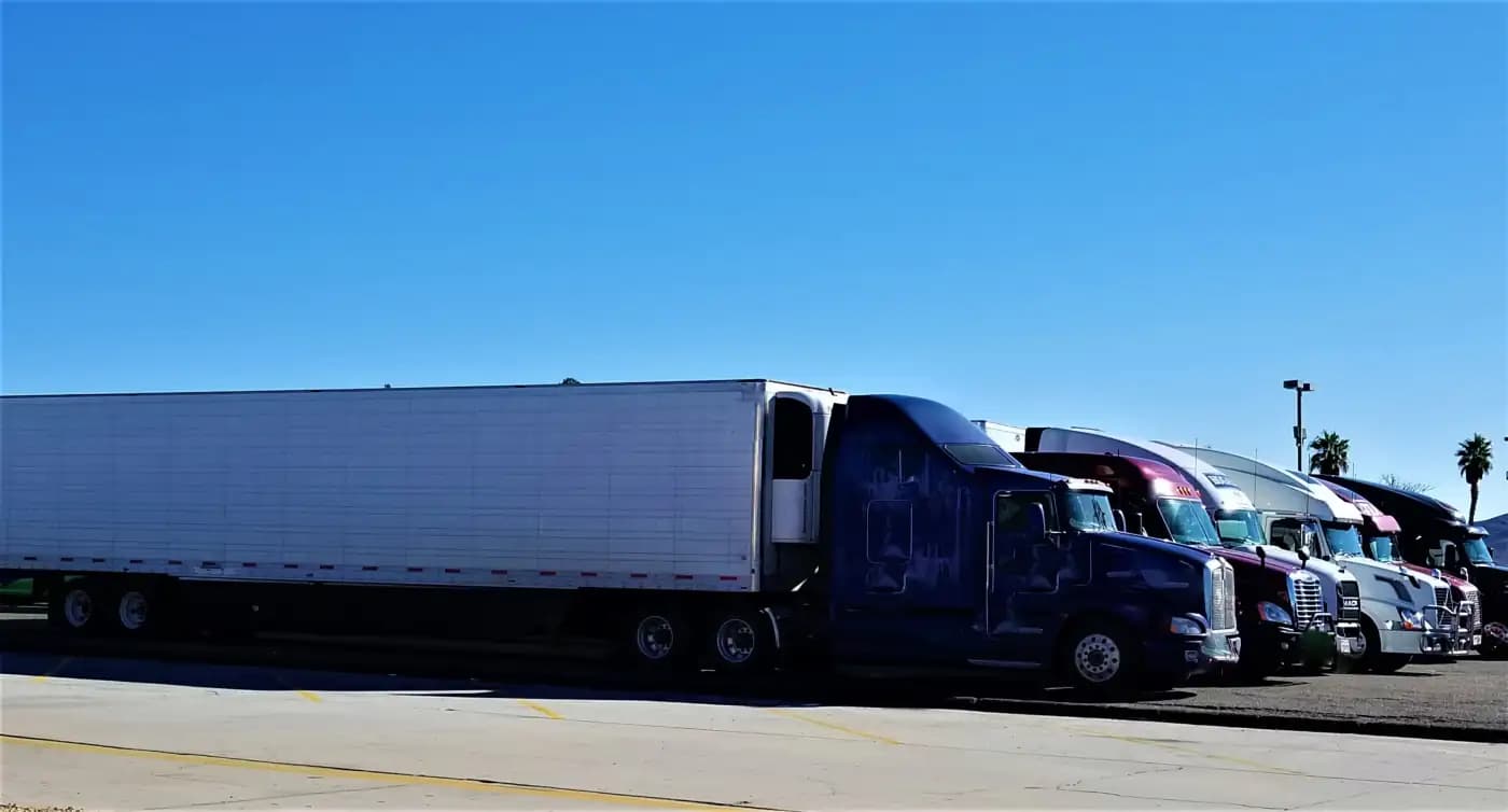 Tractor-trailers parked in a row